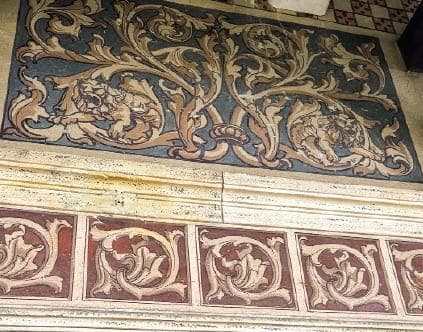 Painted foliate scrollwork within the villa